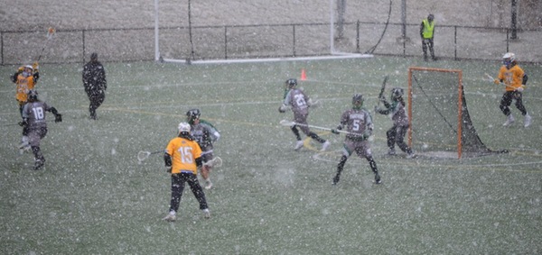 The Panthers and Cougars played through yet another blast of April snow.